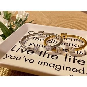 Two Stainless Steel Adjustable Clasp Bangles